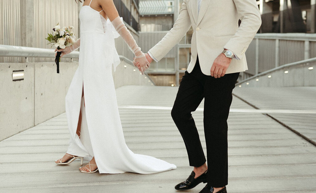 Couple walking hand in hand, Coco & Ash, an intimate and modern wedding planner based in Calgary, Alberta.  Featured on the Brontë Bride Vendor Guide.