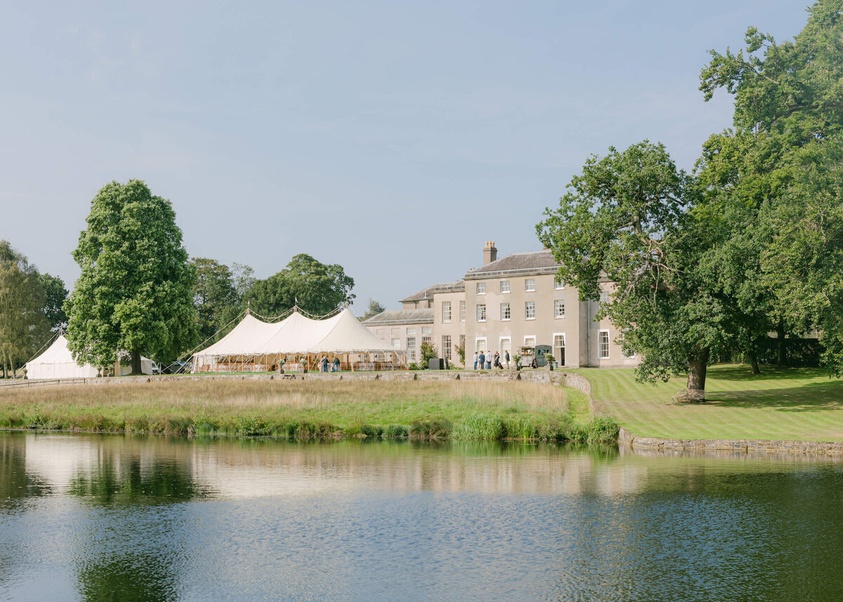 chloe-winstanley-weddings-stafford-country-house-lake-sailcloth-tent