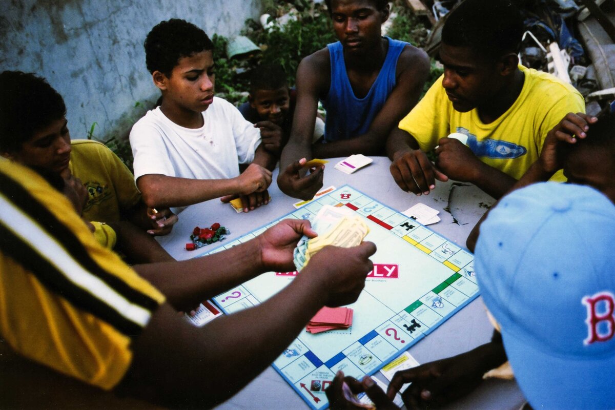 Children in an orphanage play Monopoly