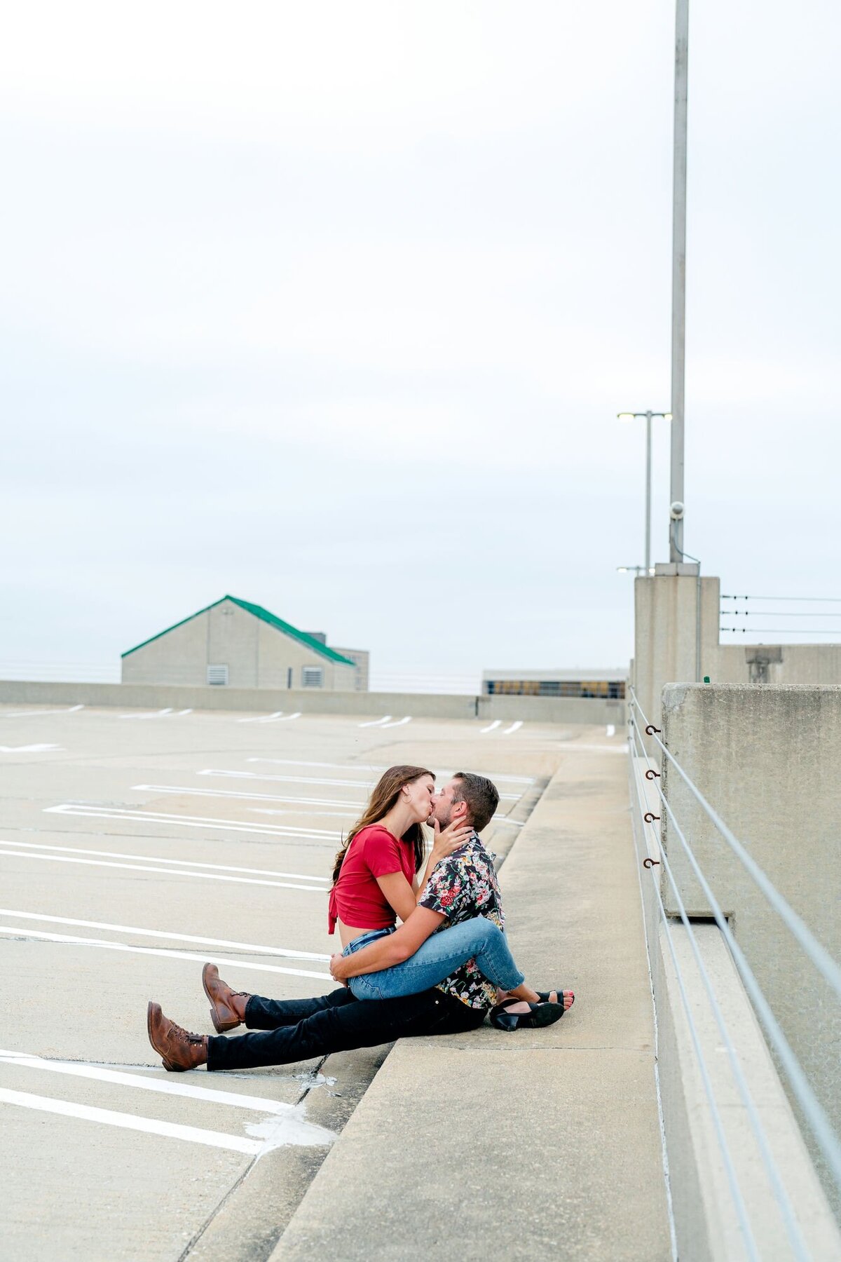 couple-kissing-parking-zoomed-out