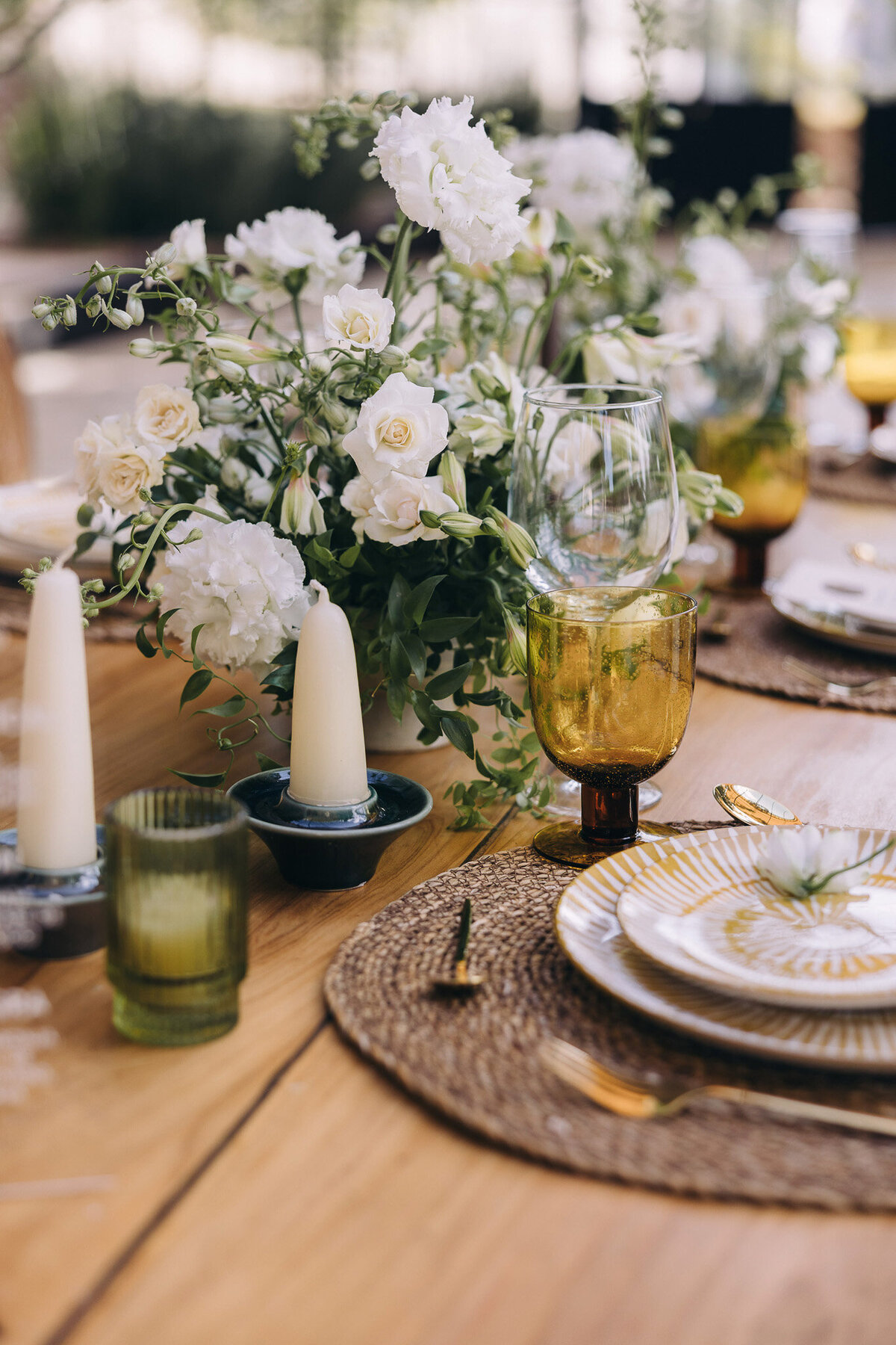 Elegant rustic wedding table décor with natural textures and earth-tone accents.