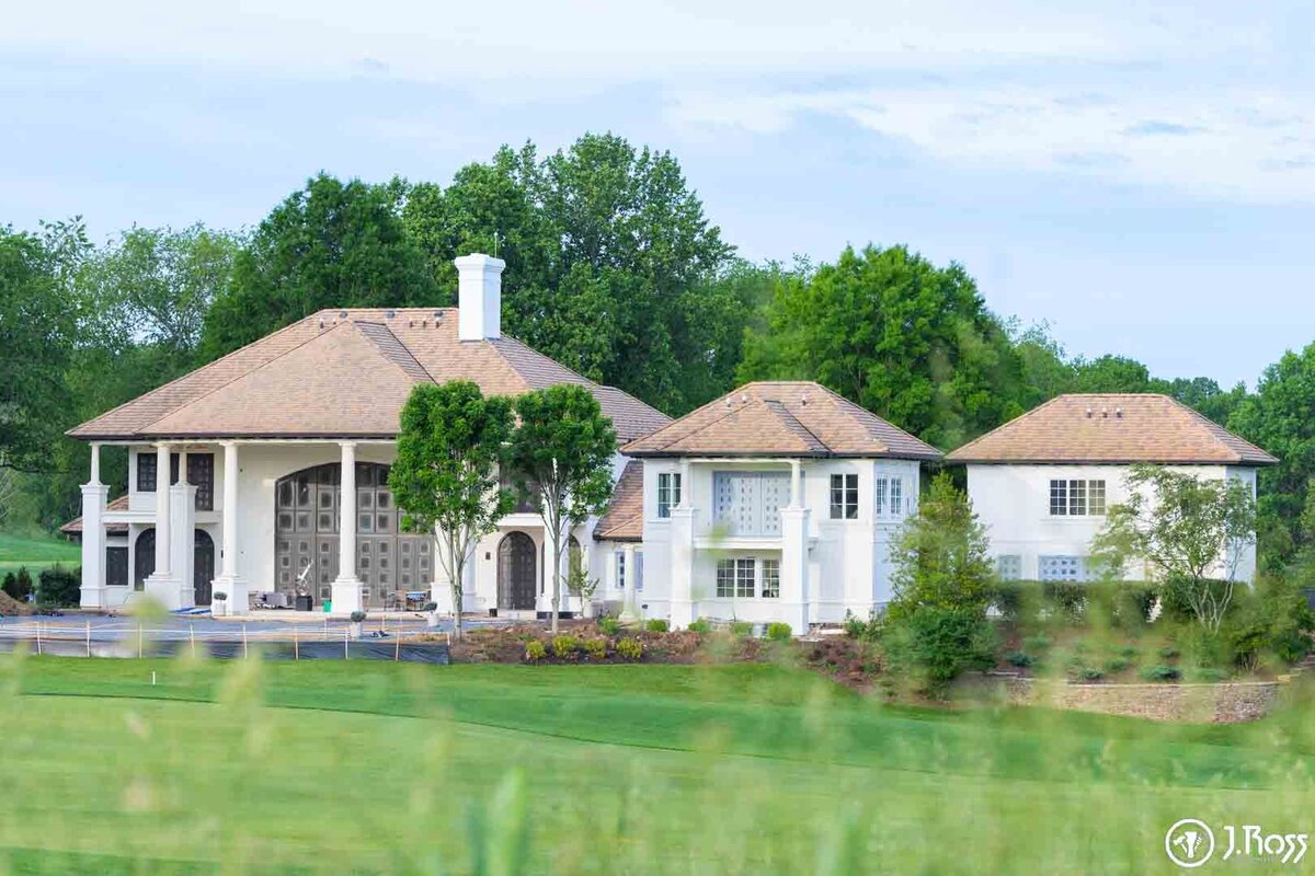Long shot of the newly painted luxury estate and auxiliary buildings, showcasing a large-scale home exterior painting Bristol, VA project and impeccable results.