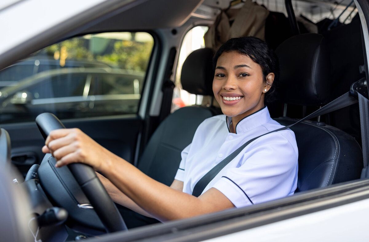King Street Cleaners employee driving the branded route service truck for local pickup and delivery across Bryan–College Station.