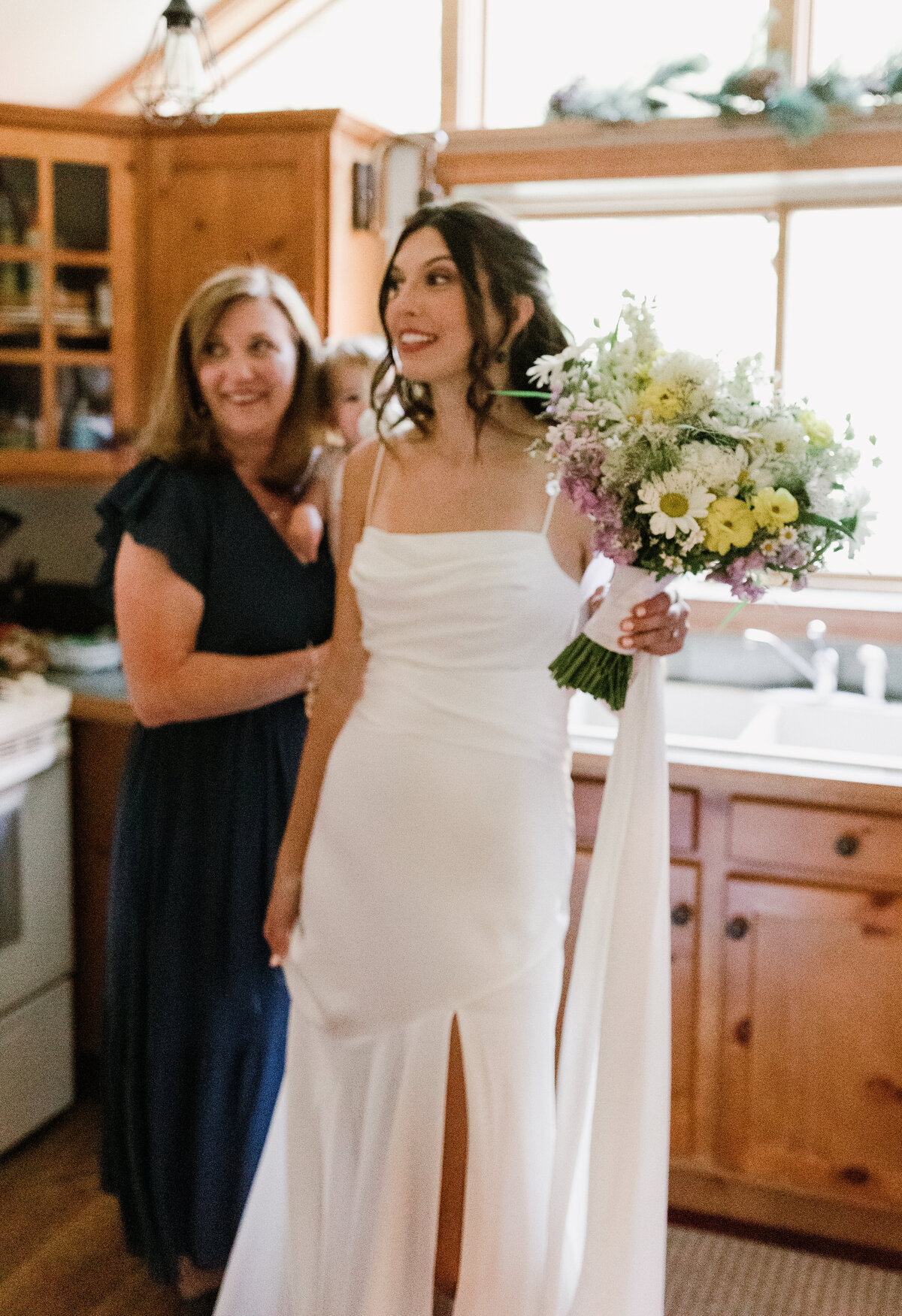 Bride in kitchen with family members