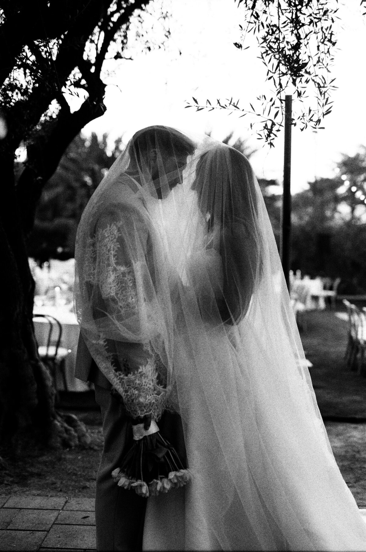 Veil photo of bride and groom shot on 35mmfilm Cache Estate