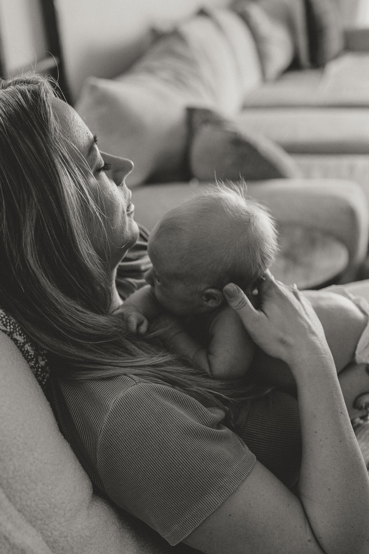 New Longmont colorado mom holding newborn while rocking