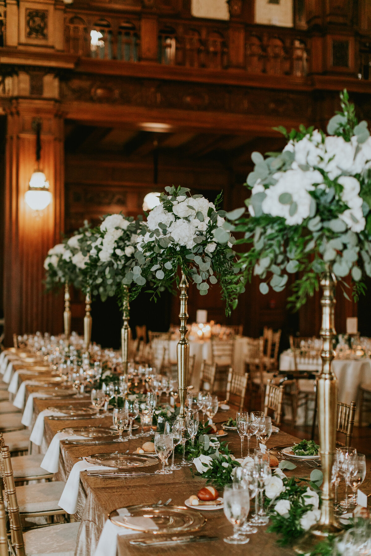 Head table at wedding with decor and flowers