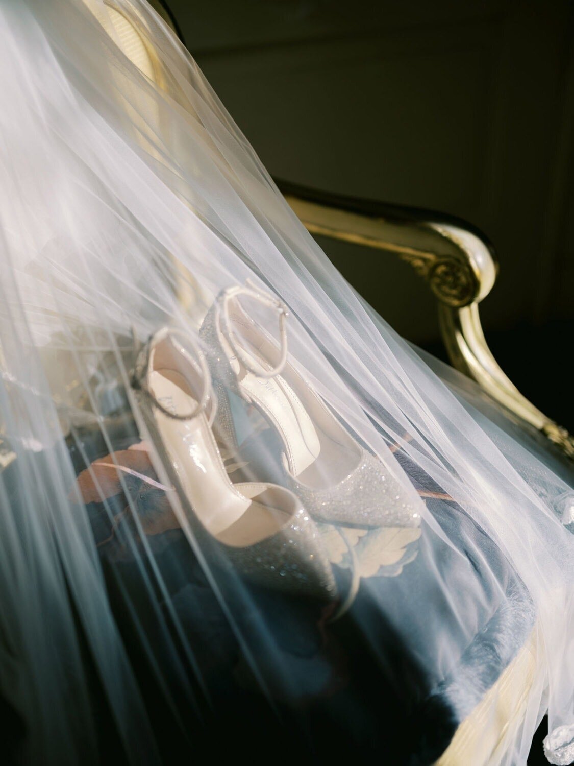 Wedding details, shoes under a veil, during a Villa Sola Cabiati wedding
