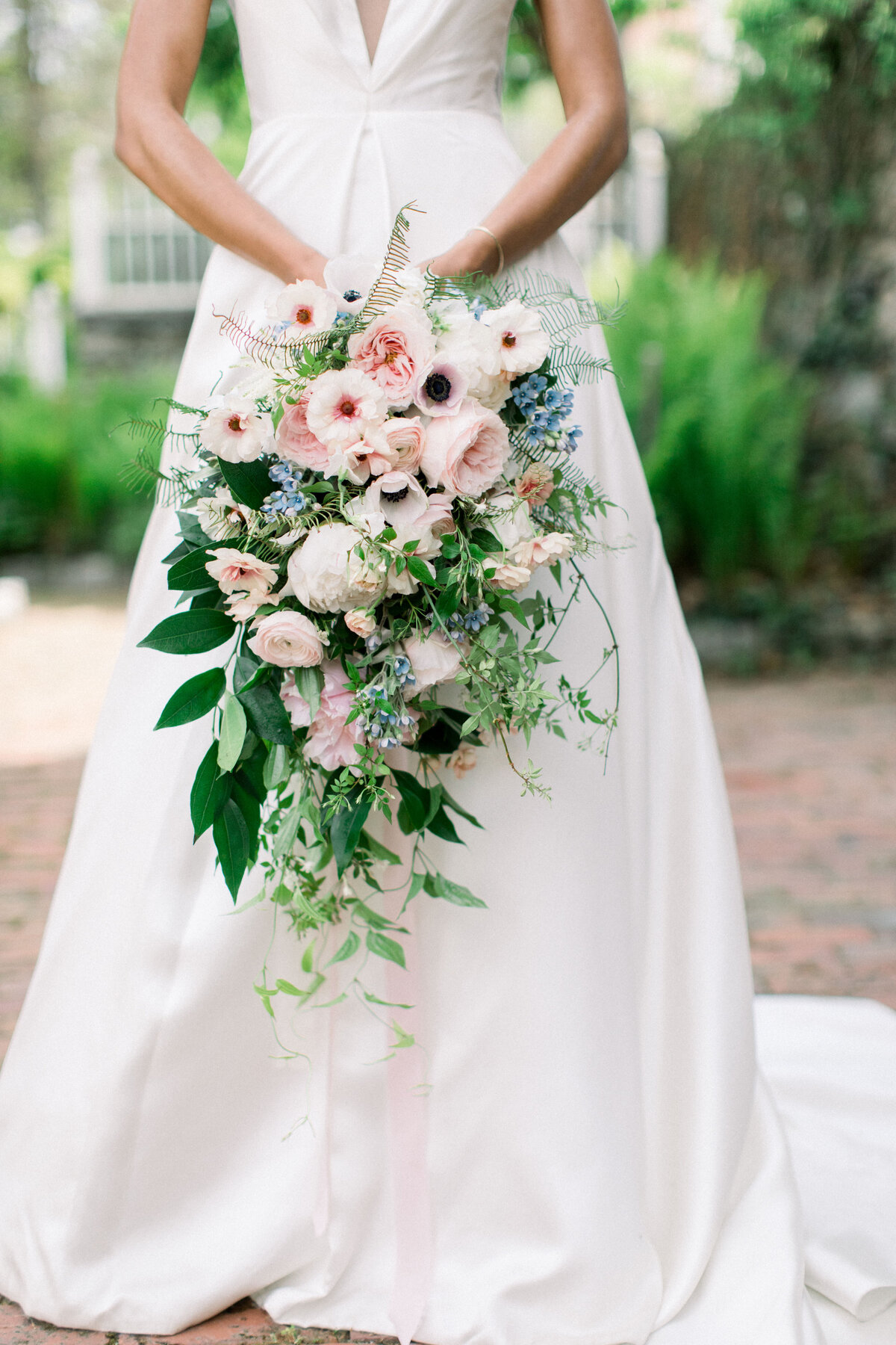 bride holding large bouquet