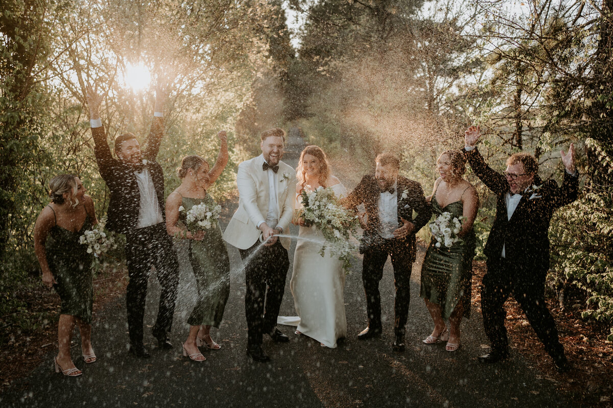 Champagne spray with bridal party at yarra valley wedding  