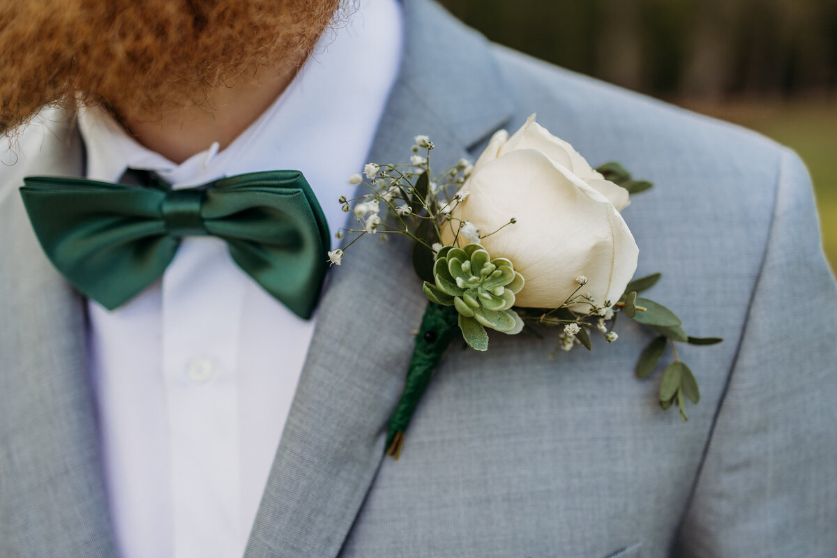 close up of grooms boutonniere