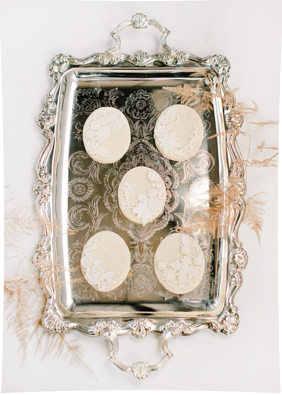 Elegant tray of beautiful handcrafted bespoke wedding sugar cookies, created by Bake My Day, contemporary cakes & desserts in Calgary, Alberta, featured on the Brontë Bride Vendor Guide.