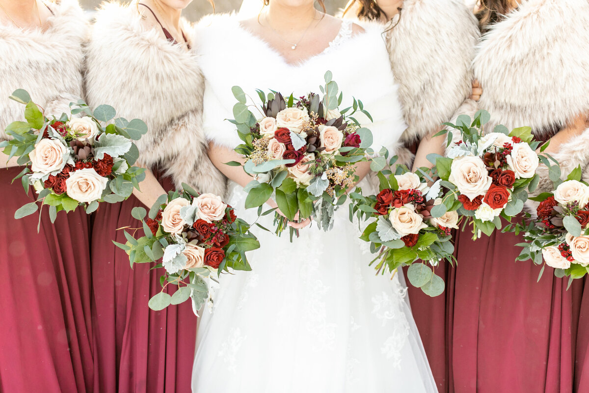 Burgundy dresses with bouquets