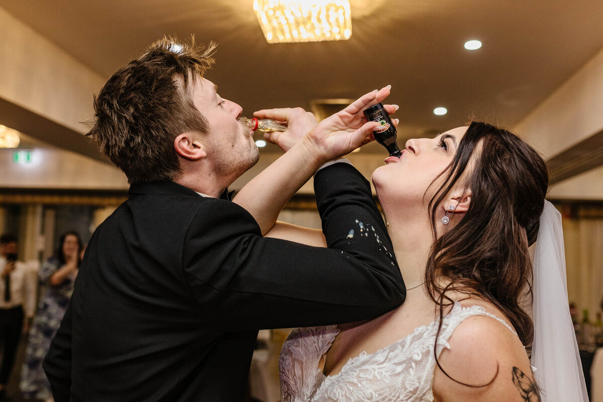 The newlyweds challenged each other by downing a small bottle of hard liquor before entering the venue reception. 