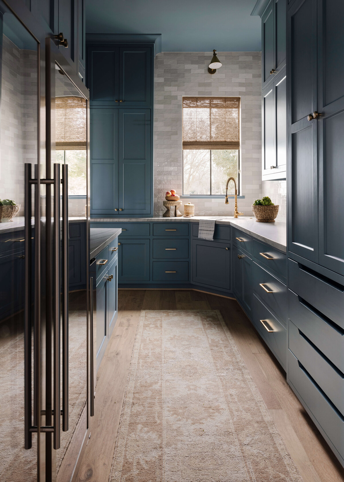 oyster creek studios missouri city new build dark blue galley kithchen with gold hardware