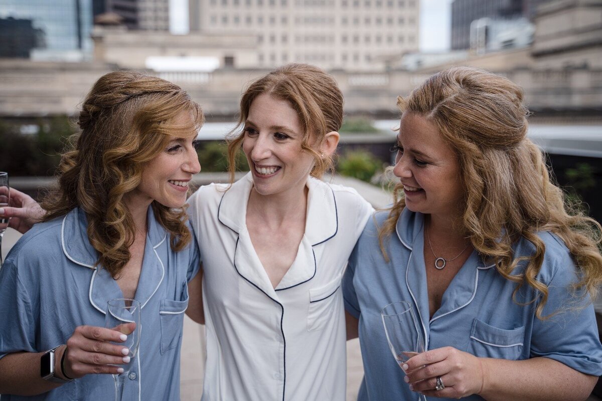 jps-events-center-bride-with-bridesmaids-laughter.jpg
