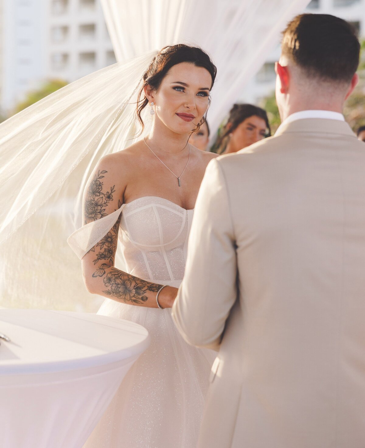 Bride looking at groom during wedding in Cancun