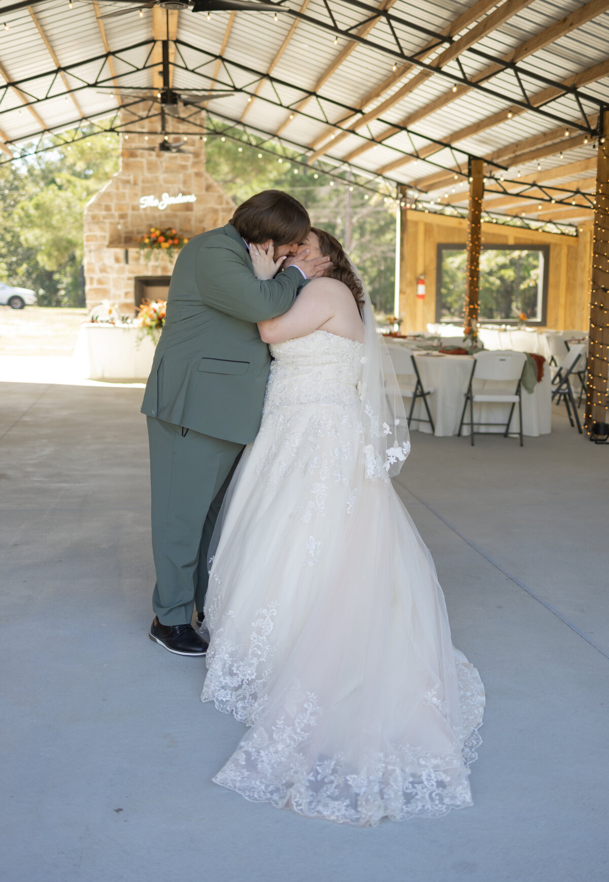 bride-and-groom-kissing-the-hidden-cabin-seale-alabama