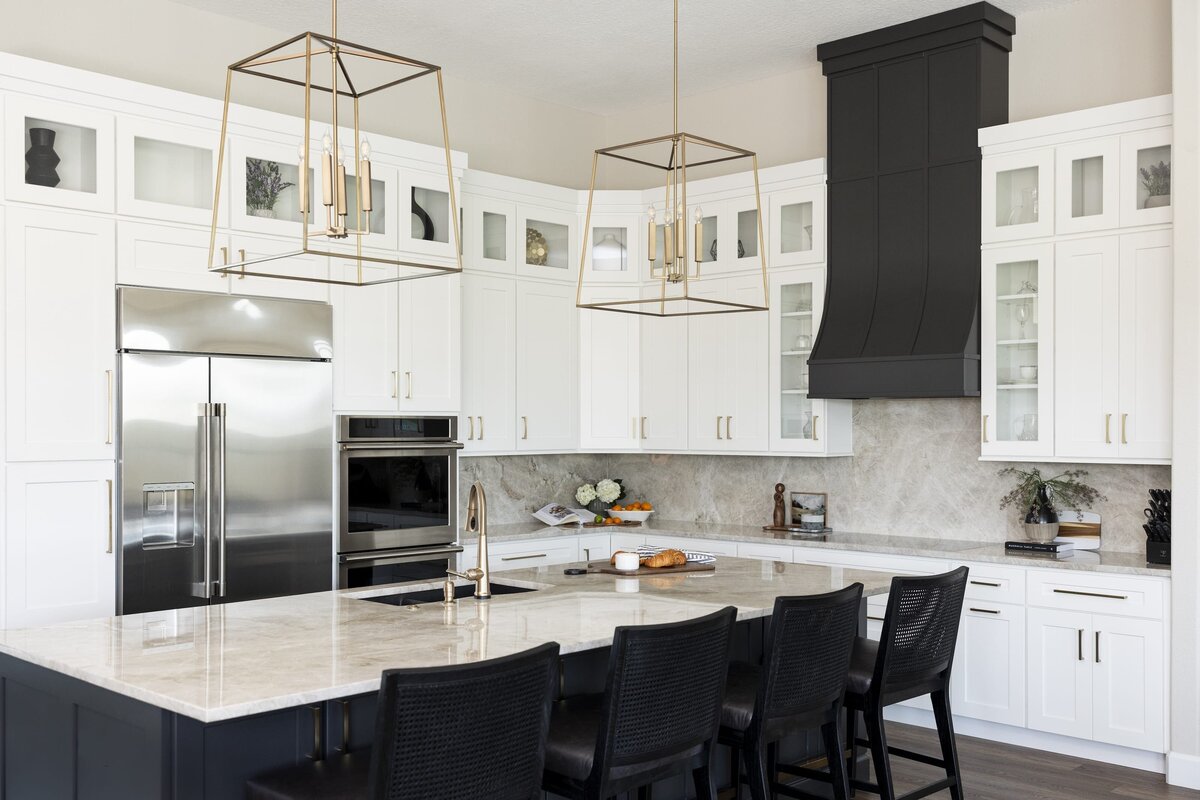 dewine design interiors windermere full house renovation kitchen with black barstools and vent hood with gold hardware