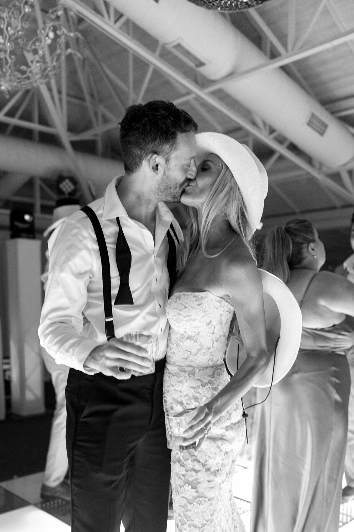 Bride and groom kiss on dance floor at reception at El Chorro