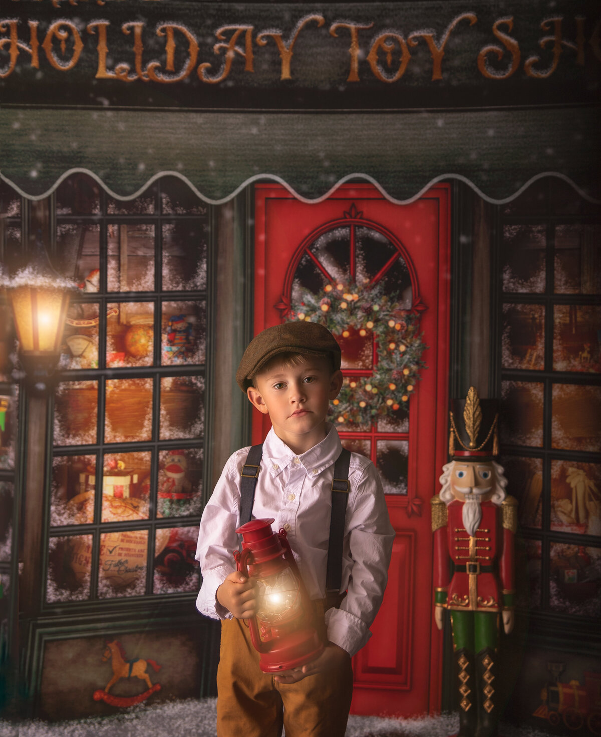 young boy posing for his Christmas portraits in a magical   Christmas photography  session in Ottawa Ontario