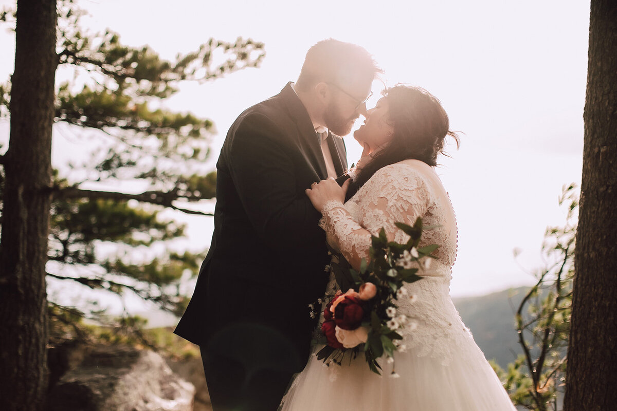 Bride and groom kiss during Devils Lake State Park Elopement
