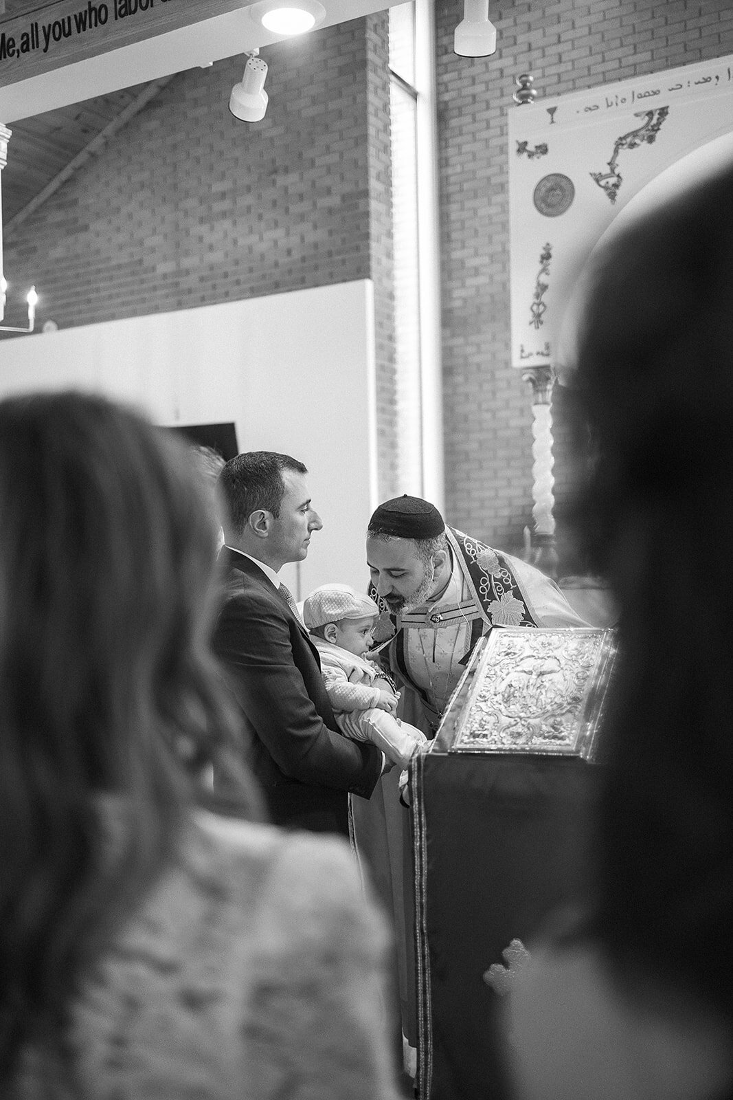 priest-reading-baby-nolan-southfield-michigan
