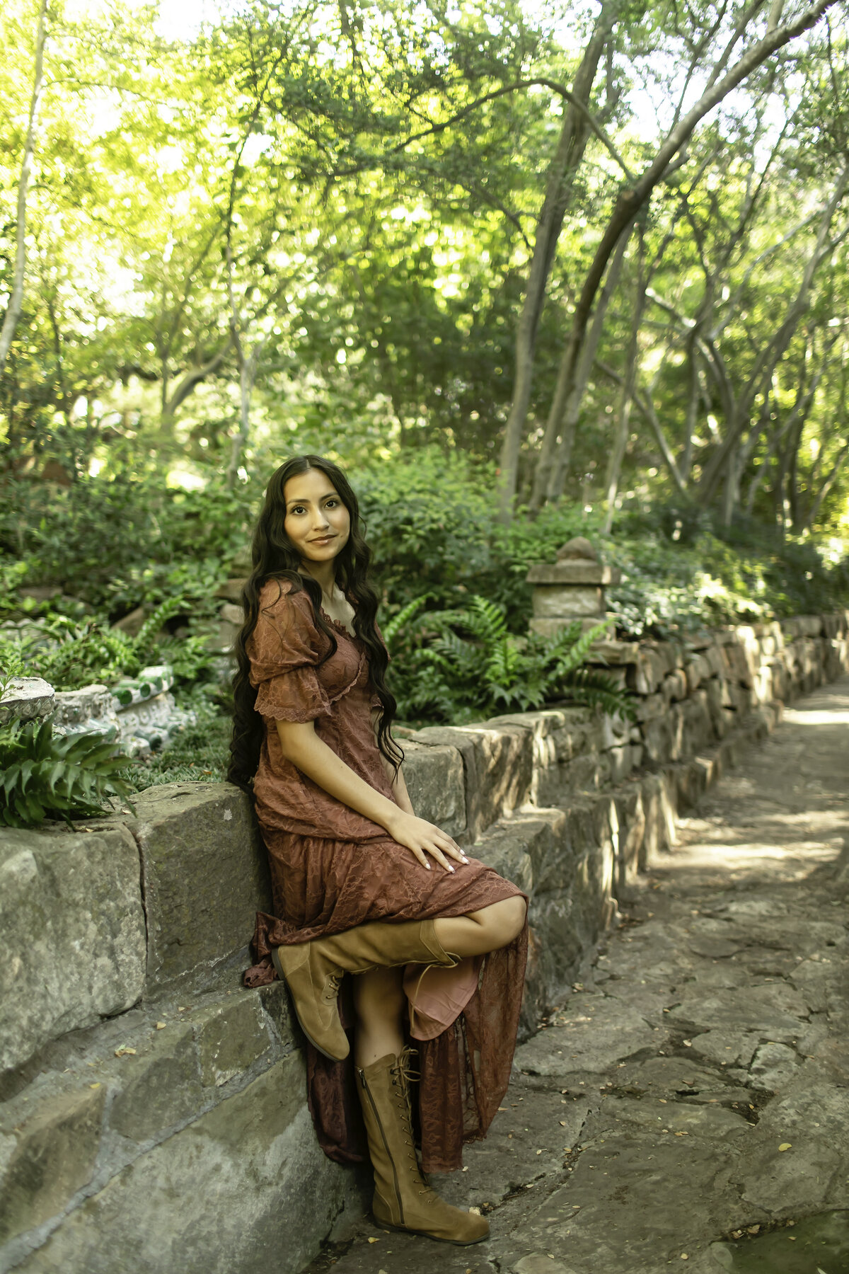A senior photoshoot at Chandor Gardens, where the stunning floral and garden scenery highlights the graduate’s elegance and anticipation for the future