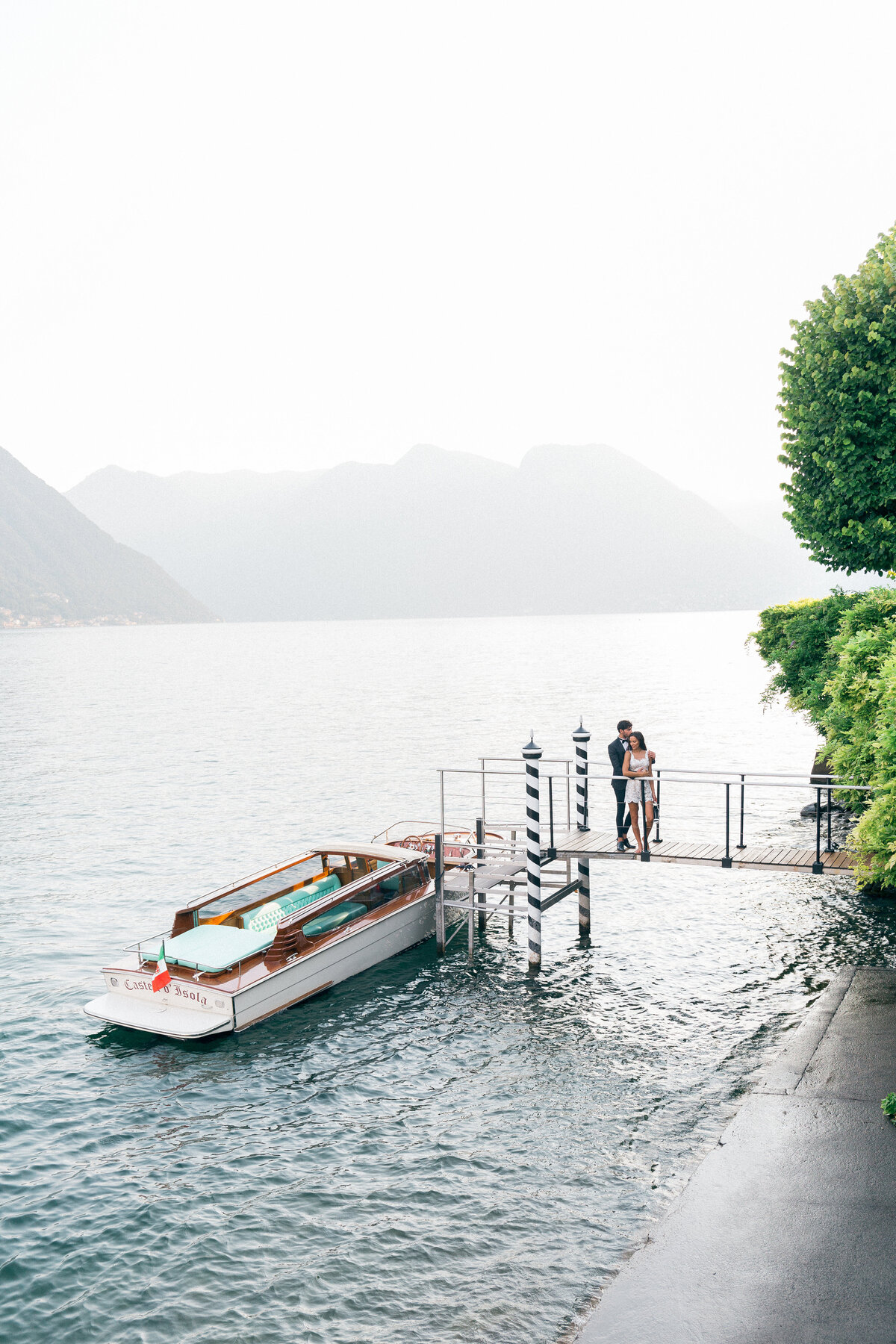 Bride and groom on a bridge of Lake Como