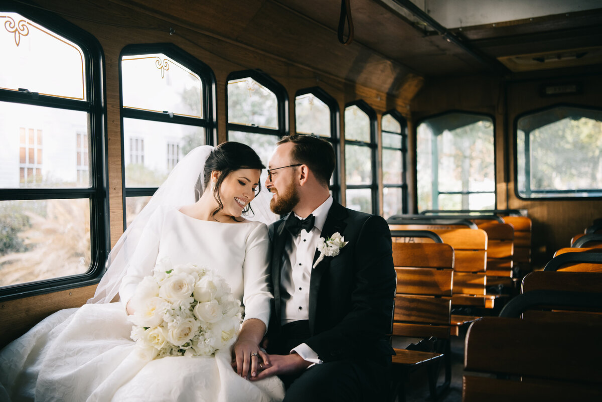 bride and groom on trolley at aiken sc wedding