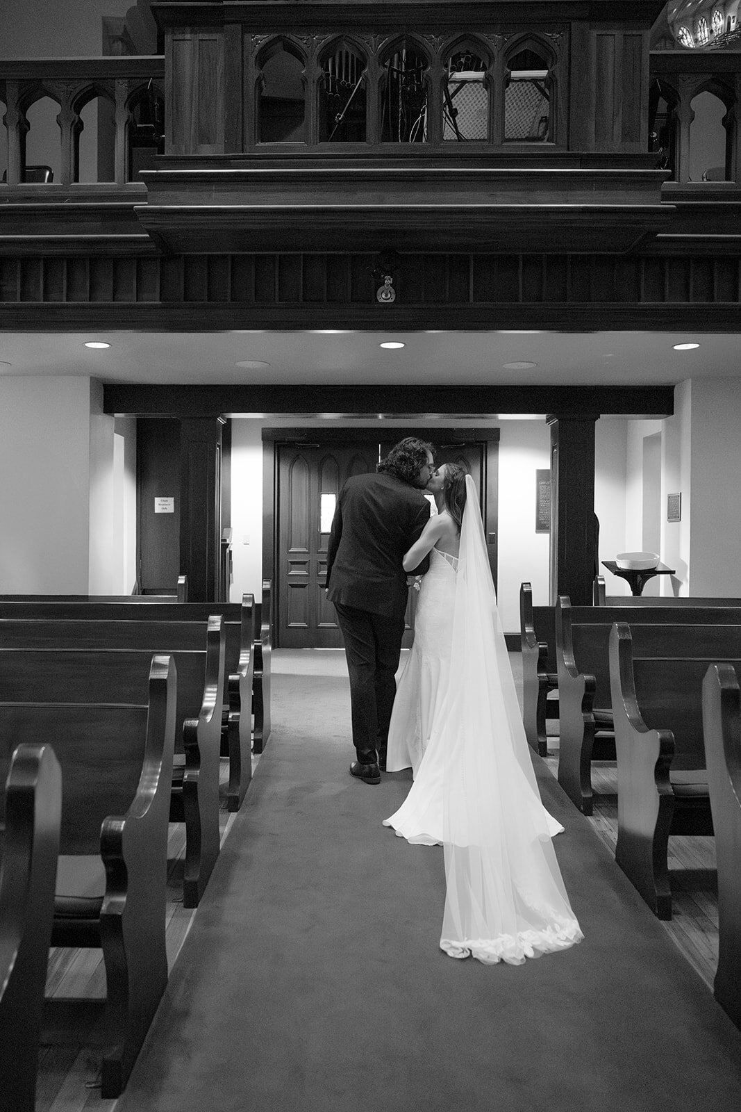 Bride and Groom share a final kiss before exiting San Antonio Cathedral Wedding