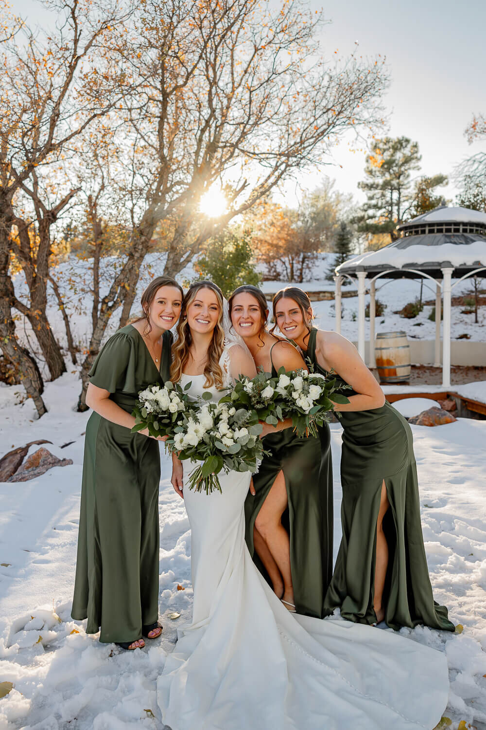bride and bridesmaids smiling for a posed portrait at creekside terrace, expertly shot by Michelle Betz Photography
