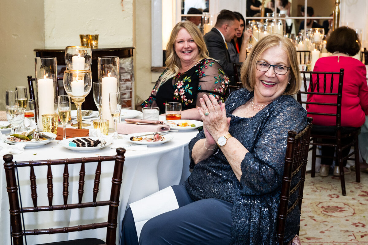 Guest claps during reception