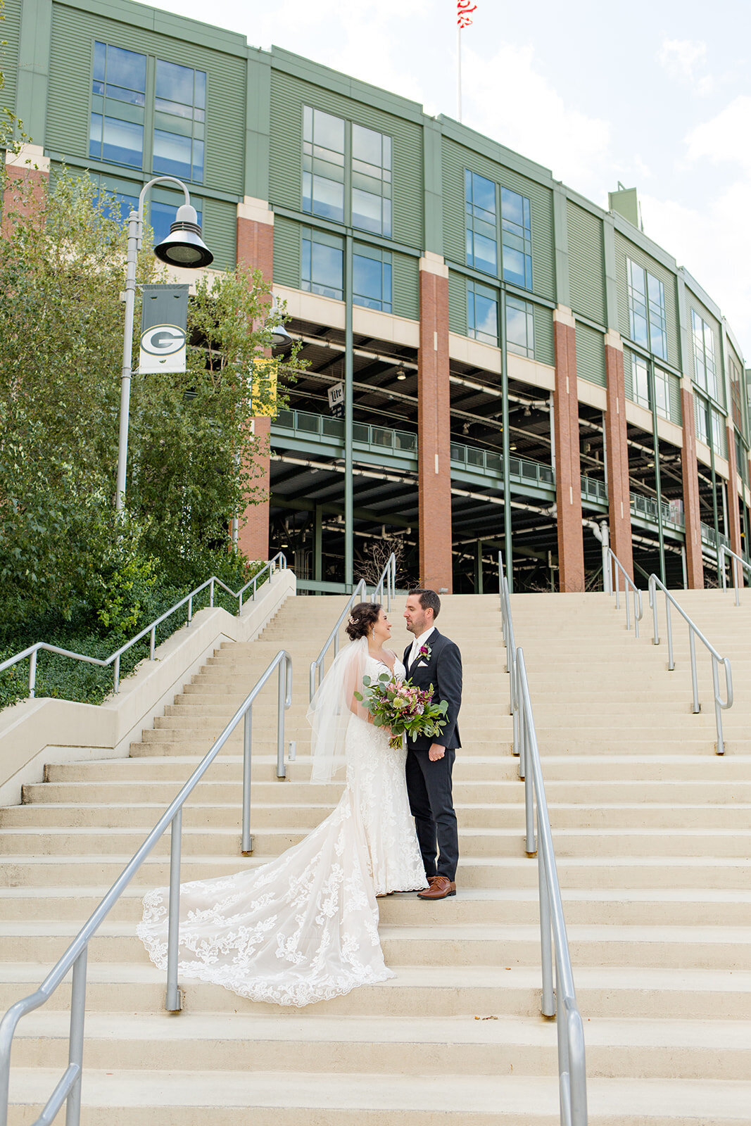 Wedding picture at lambeau field on the stairs