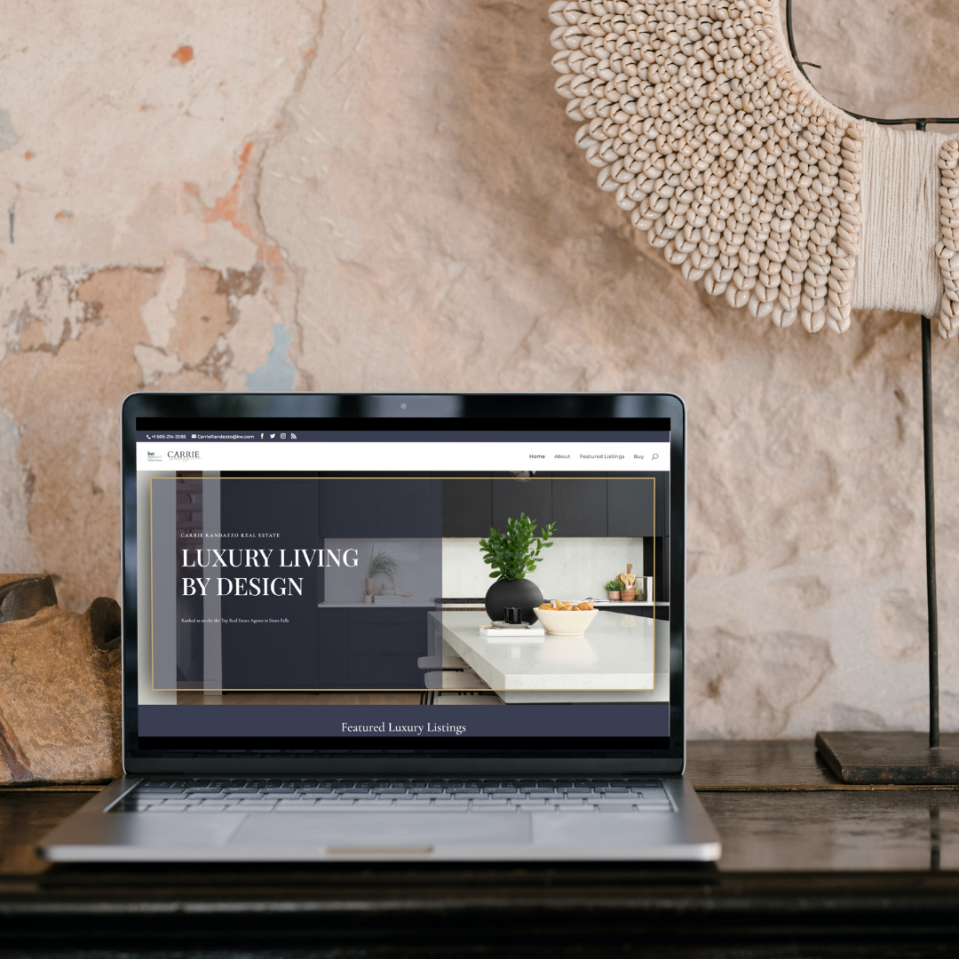 Laptop screen featuring a luxury-style homepage built for a realtor, real estate agent, or boutique brokerage.

