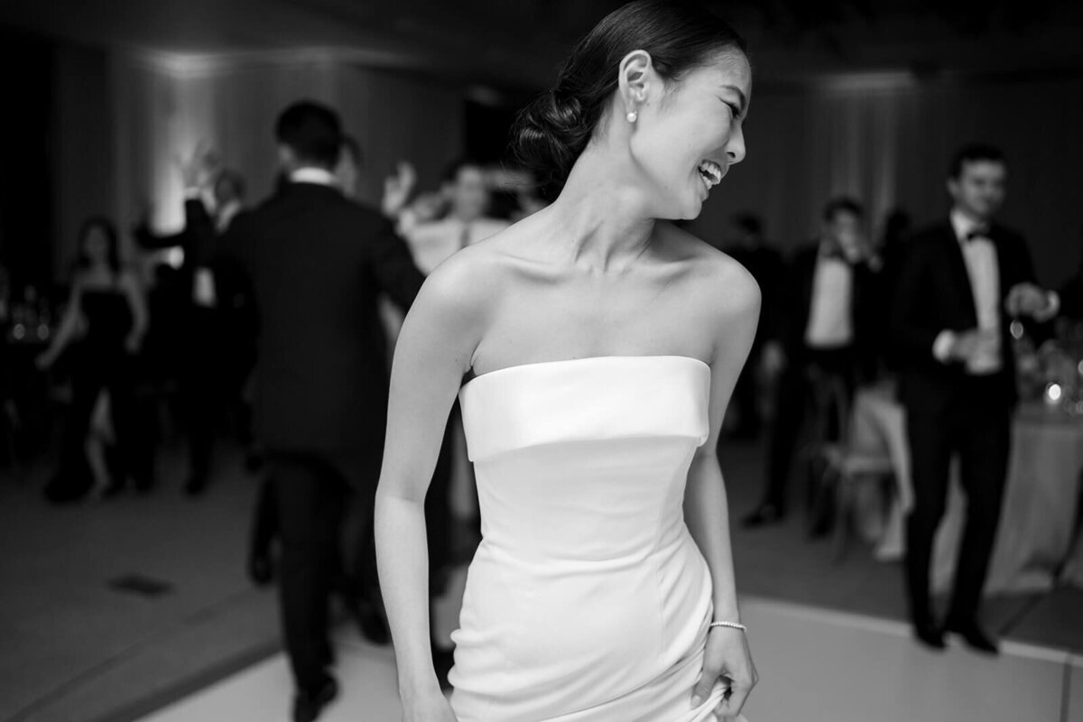 The bride dances in the middle of the dancefloor with style and grace at her Aspen Meadows Resort wedding reception venue.