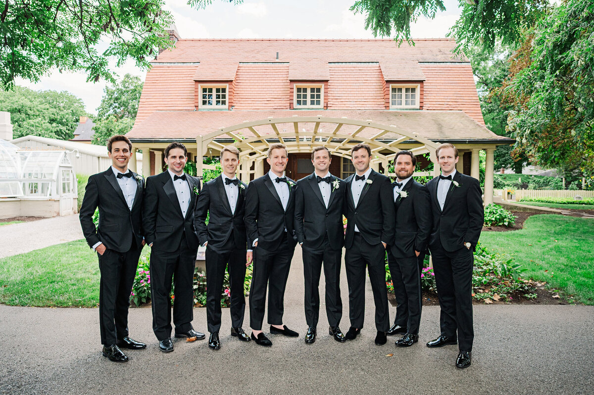 groomsmen smiling for photo at the frick museum