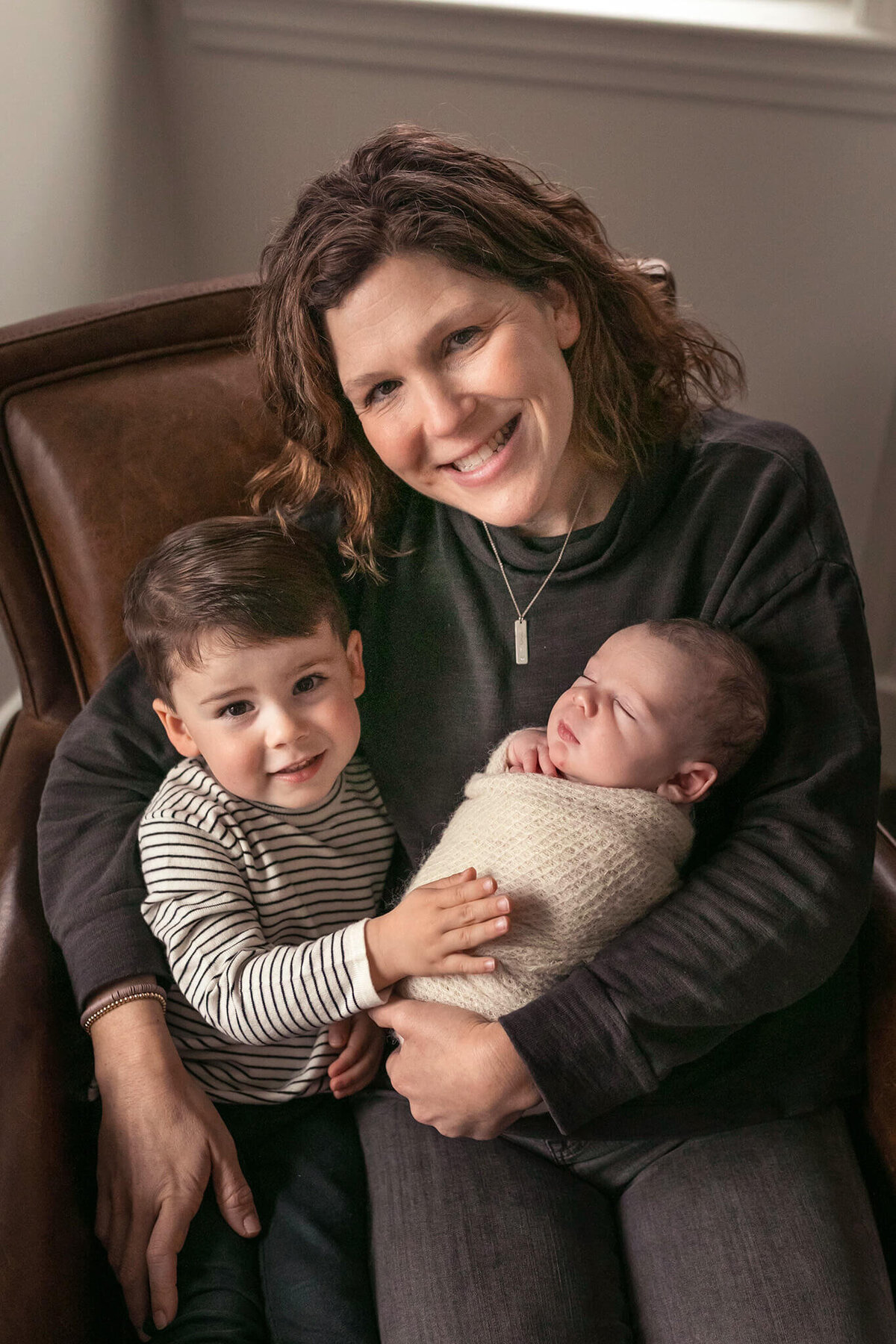 NJ Baby photographer captures mom holding her two sons close