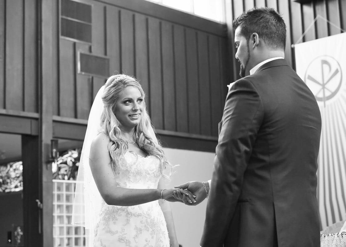 Bride and Groom Holding Hands at Wedding Ceremony