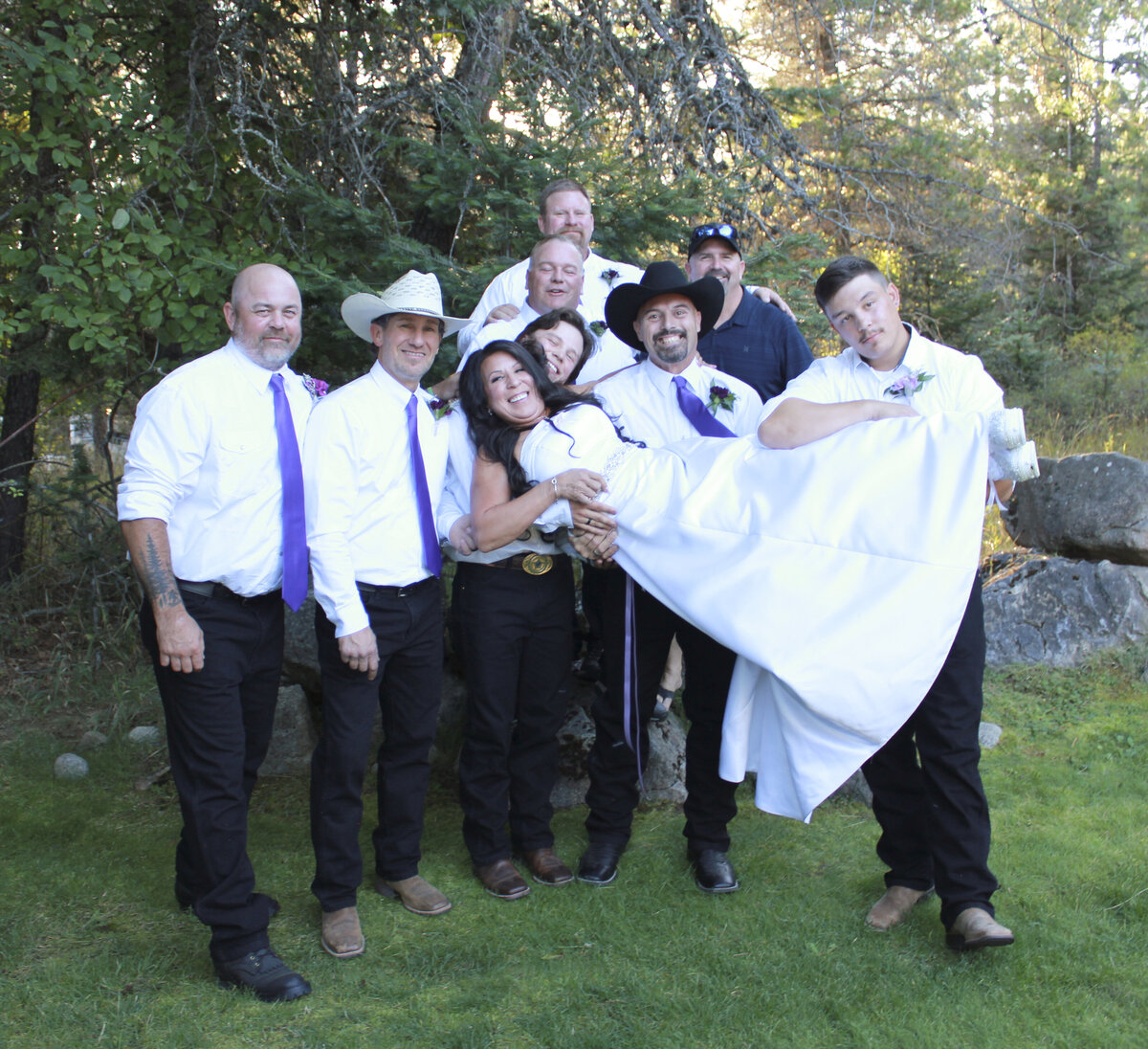 Bayview, Idaho Community Center Wedding reception groom and groomsmen holding the bride