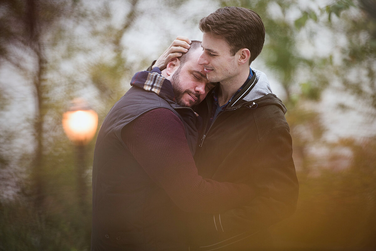 A person resting their head on their partner's shoulder