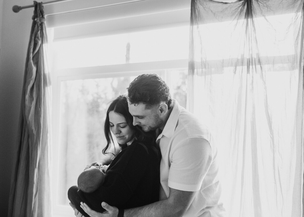 black and white parents and newborn