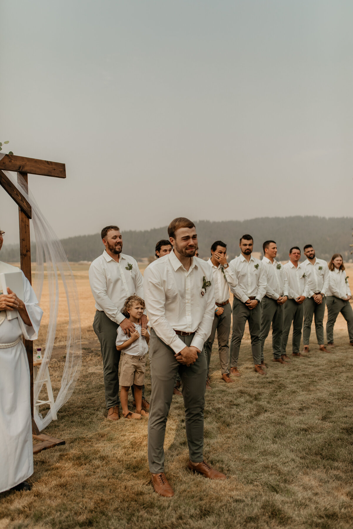 wedding party view while bride walks down the aisle