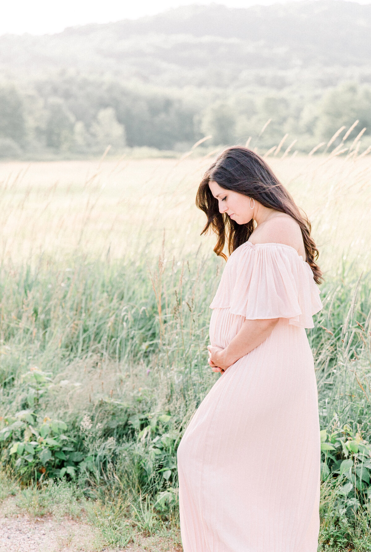mama holding baby bump during maternity session