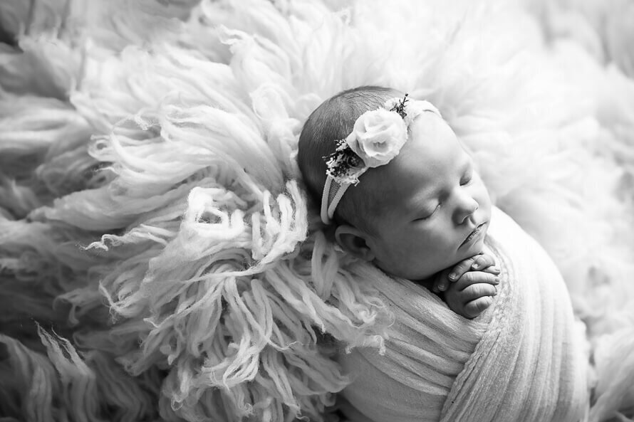 Baby girl sleeps for her photo session.