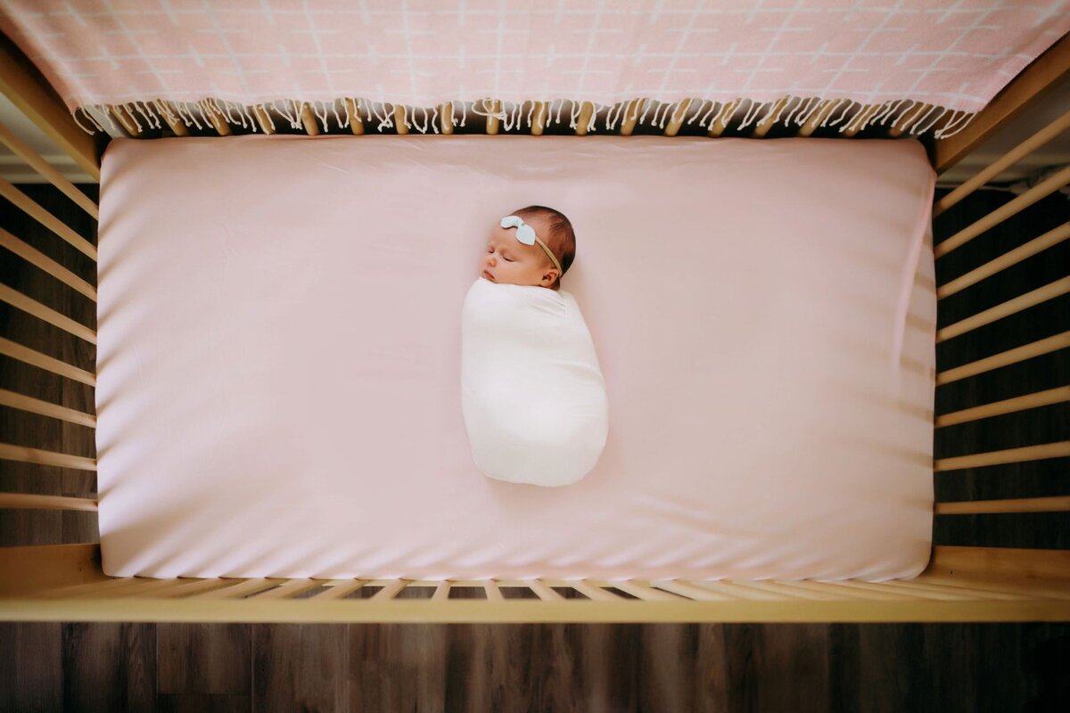 overhead photograph of a newborn in crib by Francesca Marchese Photography
