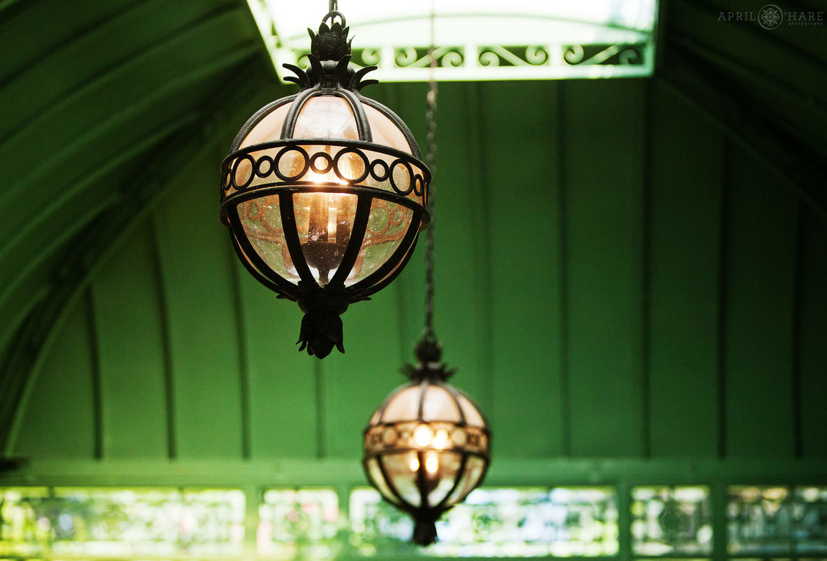 Beautiful glass globe chandeliers at the Woodland Mosaic Garden Green Solarium at Denver Botanic Gardens Wedding in Colorado