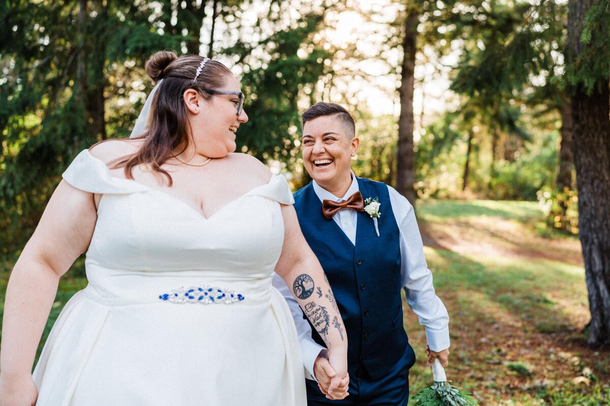 a candid moment between eloping LGBTQ couple captured by Sage Trails.