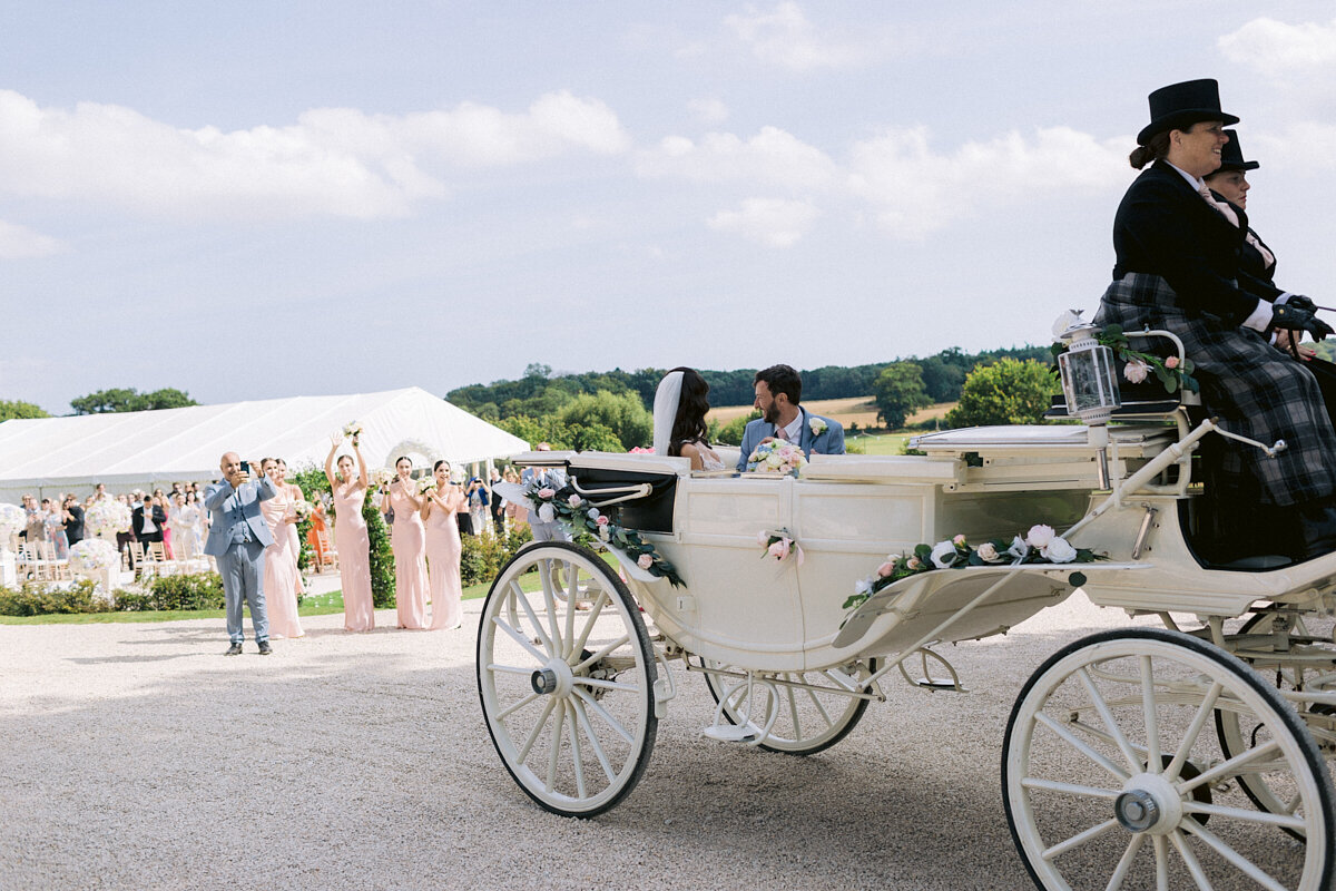 wedding horse carriage taking bride and groom for a ride
