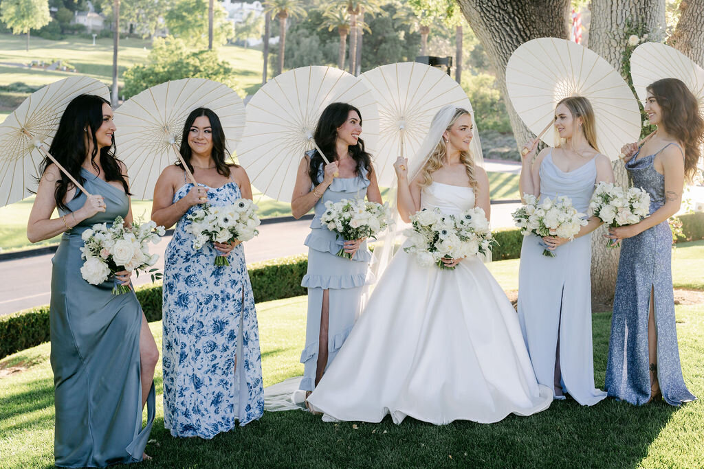 sun umbrellas, light blue bridesmaids dresses, wedding dress